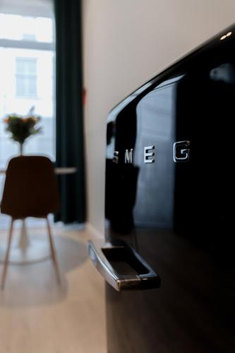 a cell phone sitting on a table next to a chair at Klapdorp in Antwerp