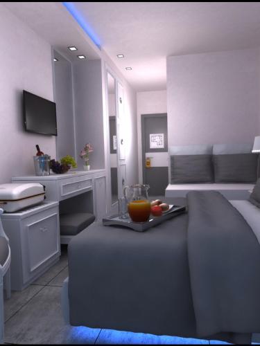 TV a/nebo společenská místnost v ubytování Kymata Hotel