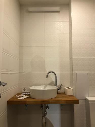 a bathroom with a sink and a toilet at Partner Guest House in Kyiv