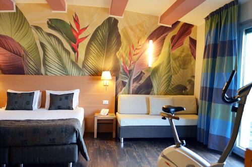 מיטה או מיטות בחדר ב-Relais Bellaria Hotel & Congressi