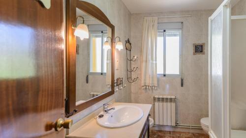 a bathroom with a sink and a mirror at Villa Maria Illora by Ruralidays in Illora