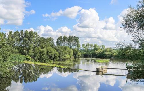 a body of water with trees and clouds in the sky at 2 Bedroom Cozy Home In La Meauffe in La Meauffe
