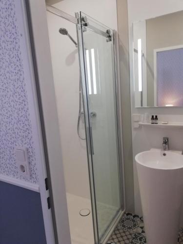 a bathroom with a shower and a sink at Boutique Hotel Kugel Wien in Vienna