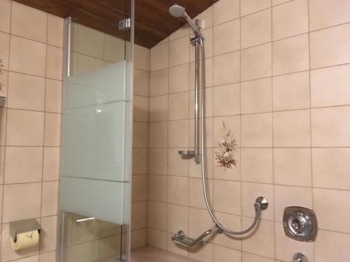 Koupelna v ubytování Hotel Garni