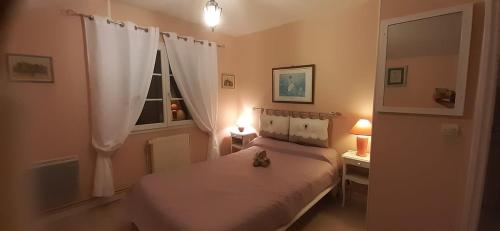 Postel nebo postele na pokoji v ubytování La petite sirène