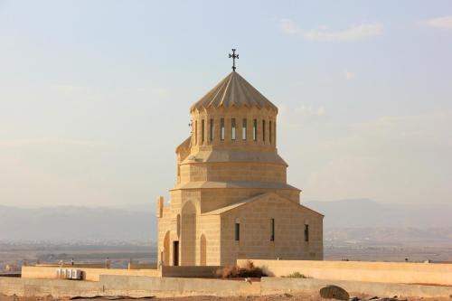 a building with a cross on top of it at Russian Pilgrim Residence in Sowayma