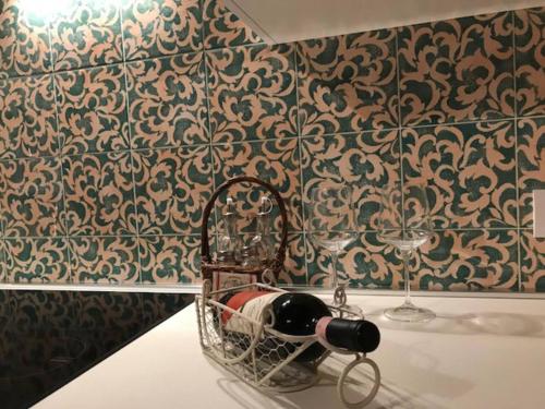 a basket on a table in a room with wallpaper at Charming apartment in Lastra a Signa with included parking in Lastra a Signa
