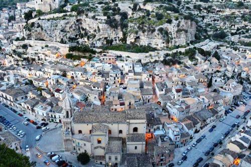 an aerial view of a city with a mountain at Charming house in Scicli with jacuzzi in Scicli