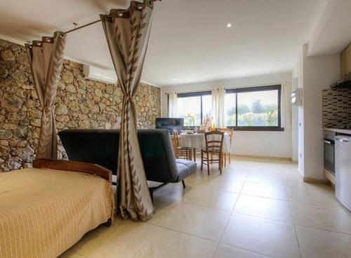 Posezení v ubytování Studio accueillant à Moltifao 30 m² avec terrasse et jardin