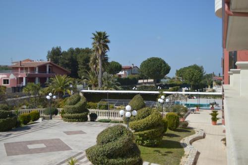 a view of a park with bushes and trees at Hotel Parco Serrone in Corato