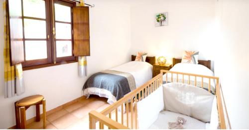 Katil atau katil-katil dalam bilik di 2 bedrooms house with furnished garden and wifi at Camacha
