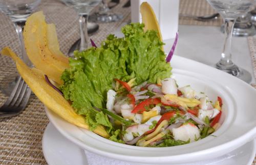 a salad in a white bowl on a table at Radisson Diamond Barranquilla in Barranquilla