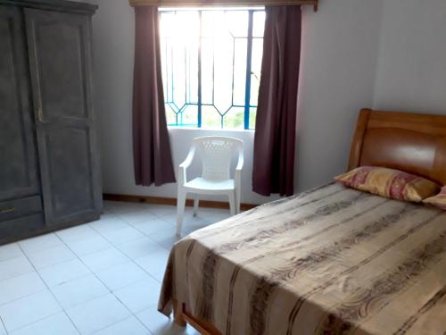 Ένα ή περισσότερα κρεβάτια σε δωμάτιο στο Seaview Apartment in Flic en Flac - 60 m² with Balcony