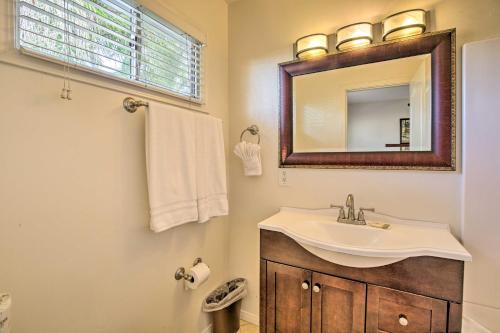 a bathroom with a sink and a mirror at Tropical Home - 200-Yard Walk to Beach Entrance! in Oceanside
