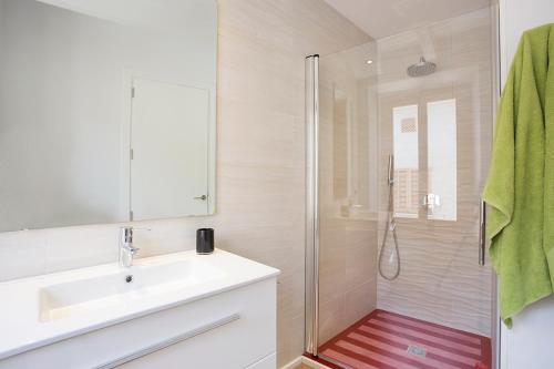 a bathroom with a sink and a shower at ANTIGUA CASA DE PUEBLO SANT SEBASTIA in Pollença