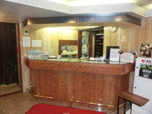 a reception counter in a restaurant with a mirror at Hotel Suntargas Otsuka - Vacation STAY 08494v in Tokyo