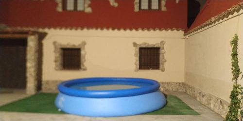 a toy house with a blue frisbee in it at CASAS LA MURALLA in Peñafiel
