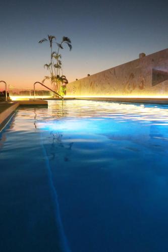 a swimming pool at night with a skate park at Holiday Inn & Suites - Puerto Vallarta Marina & Golf by IHG in Puerto Vallarta