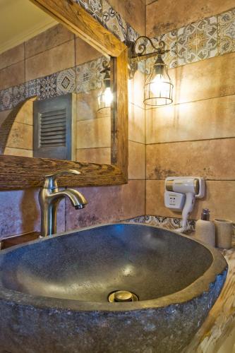 a bathroom with a sink and a mirror at Villa Anastasia in Voládha