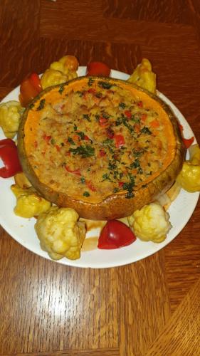a plate of food with a pie on a table at Pensiunea Agroturistica Cerna, Vaideeni - Polovragi in Vaideeni