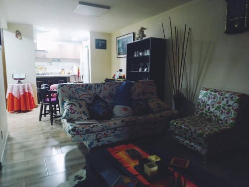 a living room with a couch and a table at Mi Casa, Tu Casa-Hostal Tunja-Boyaca in Santa Rosa de Viterbo