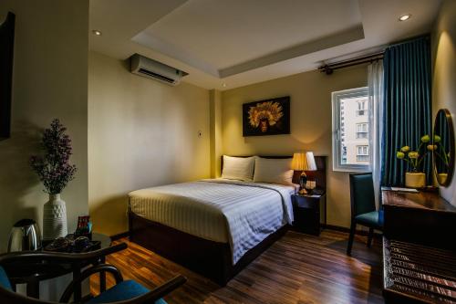 Säng eller sängar i ett rum på Roseland Sweet Hotel & Spa