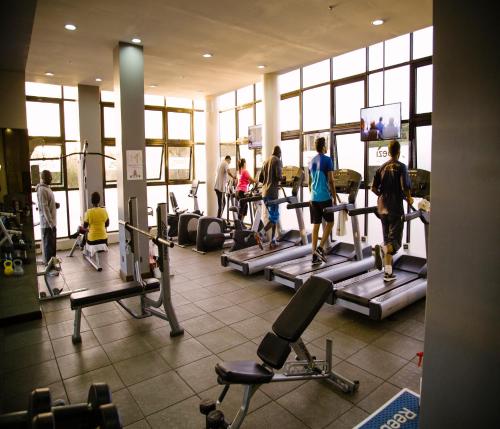 a group of people walking around a gym at Boma Inn Eldoret in Eldoret