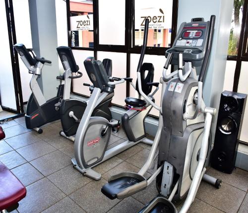 a row of exercise bikes in a gym at Boma Inn Eldoret in Eldoret