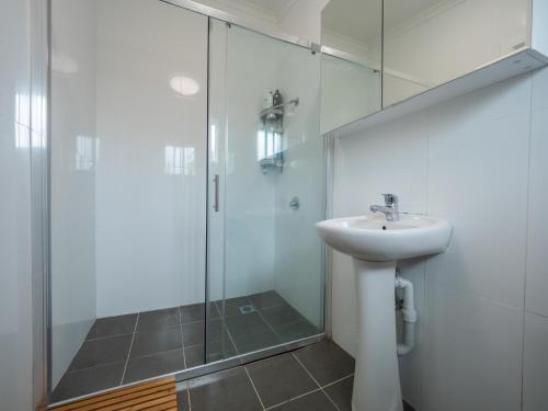 a bathroom with a sink and a glass shower at Quiet Private Double Room in Kingsford near UNSW, Randwick Light Railway&Bus G3 - ROOM ONLY in Sydney
