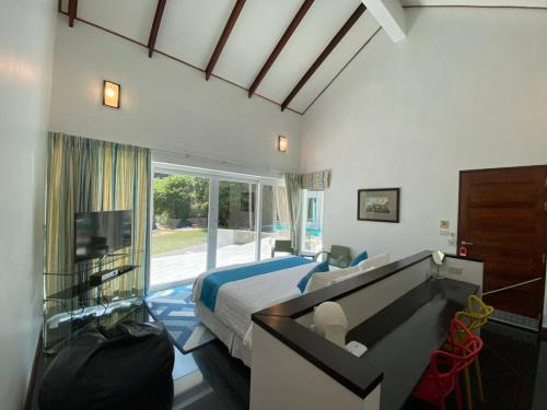 En eller flere senger på et rom på Krabi Beach House, SHA Extra Plus