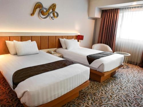 Cama o camas de una habitación en Verwood Hotel and Serviced Residence