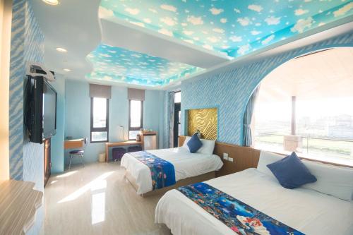 Postel nebo postele na pokoji v ubytování Lanyang Beach Villa