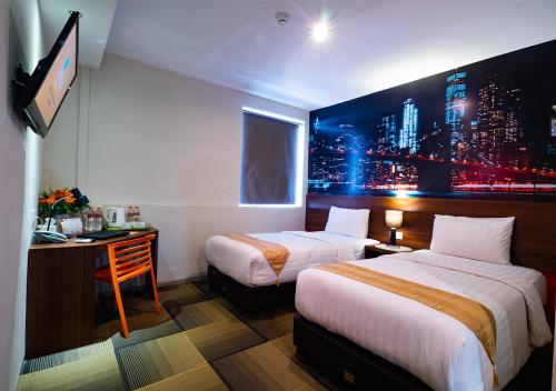 Postel nebo postele na pokoji v ubytování Miyanna Hotel