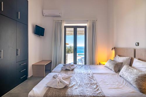 Posteľ alebo postele v izbe v ubytovaní Pyrgos Plakias