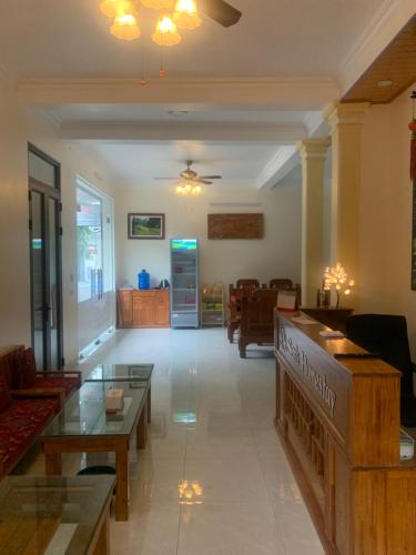 a living room with a couch and a table at Sen's Homestay in Ninh Binh