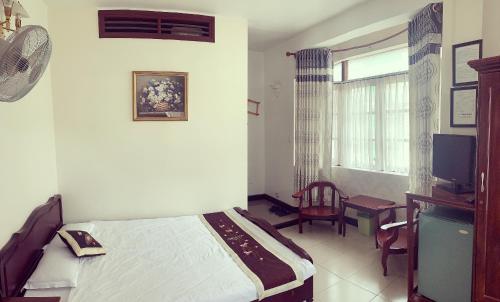 Кровать или кровати в номере Da Lat 24h Guesthouse & Hotel