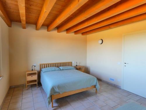 Ένα ή περισσότερα κρεβάτια σε δωμάτιο στο Agriturismo il Fontanile