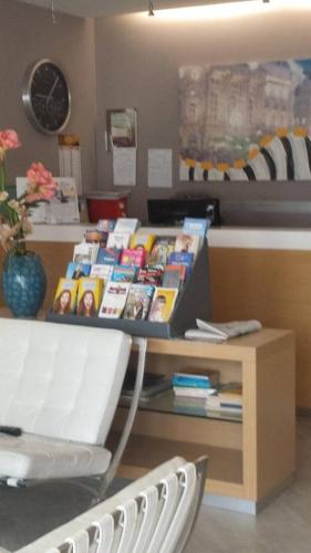 a room with a table with a box of books at Hotel Main Street in Cerasolo