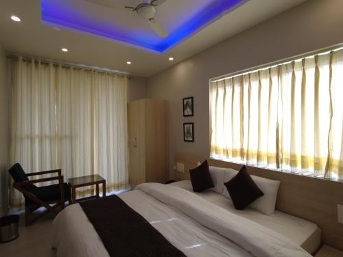 Zona de estar de Punyah Residency Rishikesh