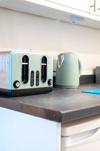 a toaster sitting on top of a kitchen counter at No11 Nursery Covent in Mansfield