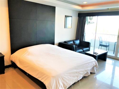 Postel nebo postele na pokoji v ubytování Platinum Suites studio condo Jomtien