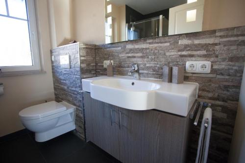 a bathroom with a sink and a toilet at Lebensfreude in Farchant