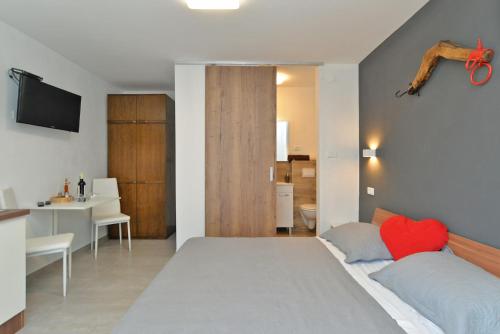 Posteľ alebo postele v izbe v ubytovaní Apartment Mirella 1745