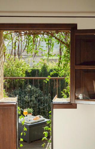 an open door to a balcony with a view of a garden at Can Joan Capo - Adults Only in Sineu