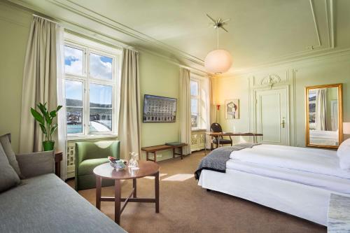 A bed or beds in a room at Grand Hotel Terminus
