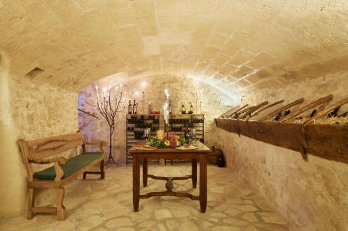 a wine cellar with a table and a chair at Can Joan Capo - Adults Only in Sineu