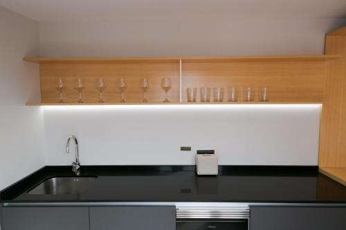 a kitchen with a sink and a counter top at EL CIELO DE CÁCERES in Cáceres