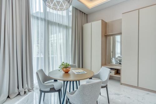 a dining room with a table and chairs at Hyatt Regency Kotor Bay Resort in Kotor