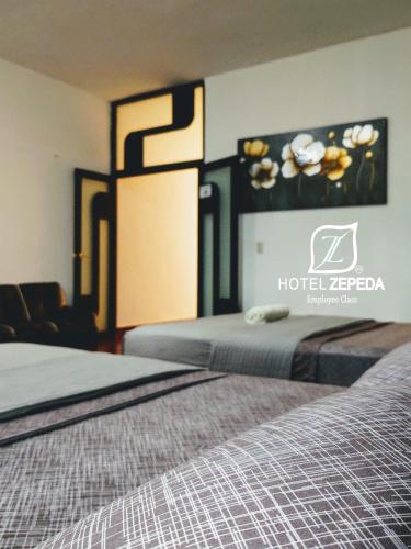 Ένα ή περισσότερα κρεβάτια σε δωμάτιο στο Hotel Zepeda