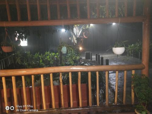 a wooden bench in a garden at night at Havelock Farms Resort in Havelock Island